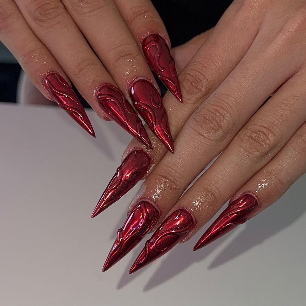 Red Chrome Nails With Swirls 