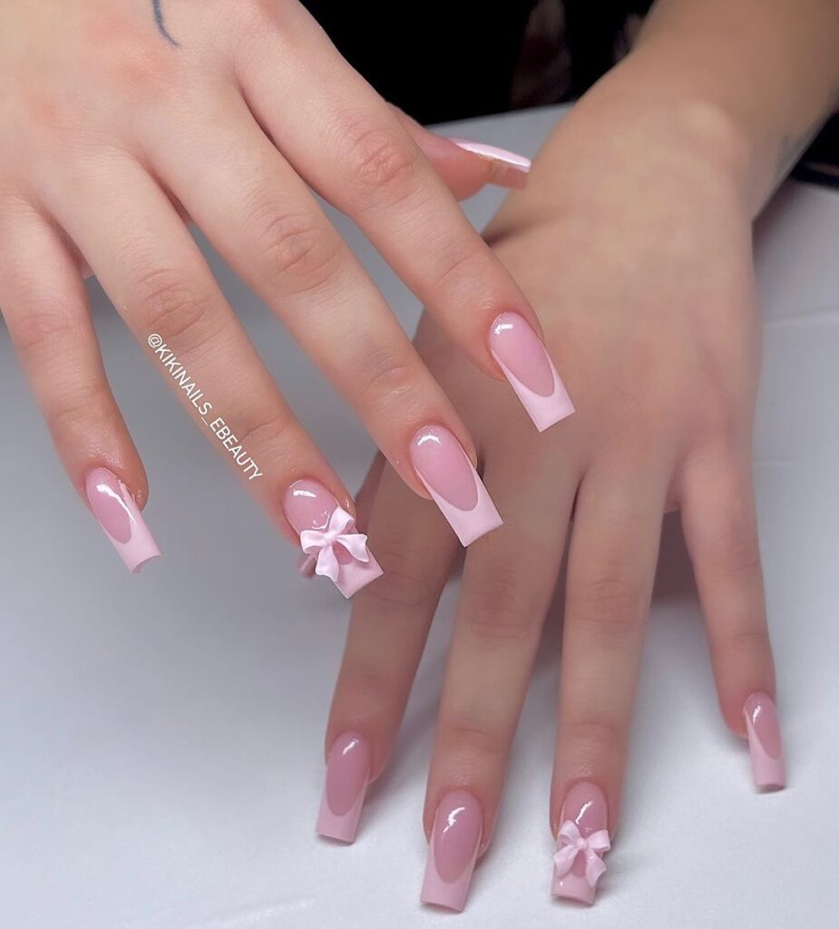 acrylic nails nude with a bow