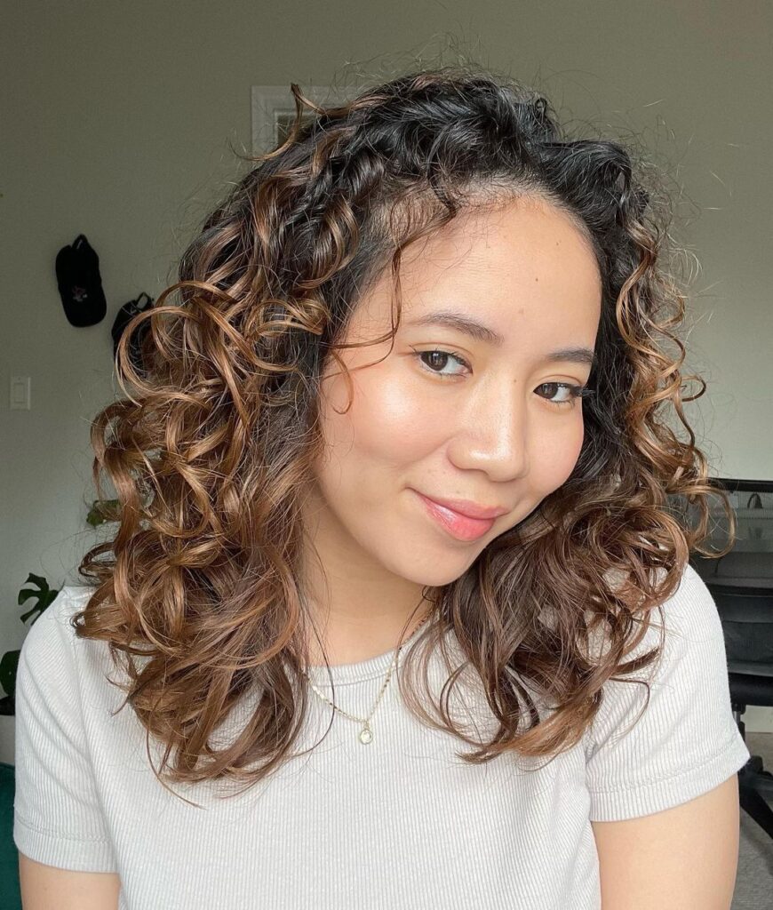 caramel highlights on curly wavy hair
