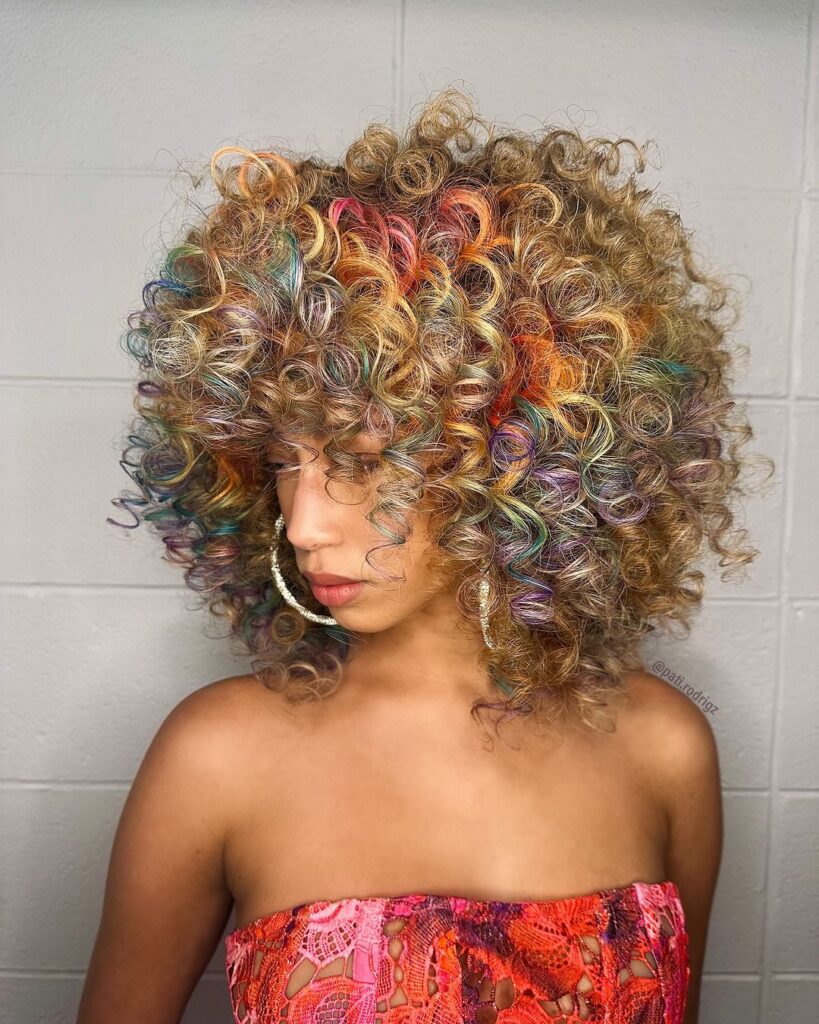 round curly cut on colourful hair 
