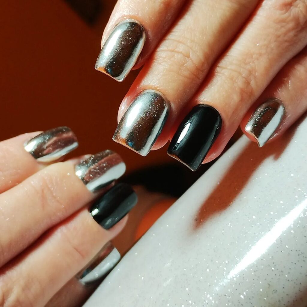 silver and black metallic nails