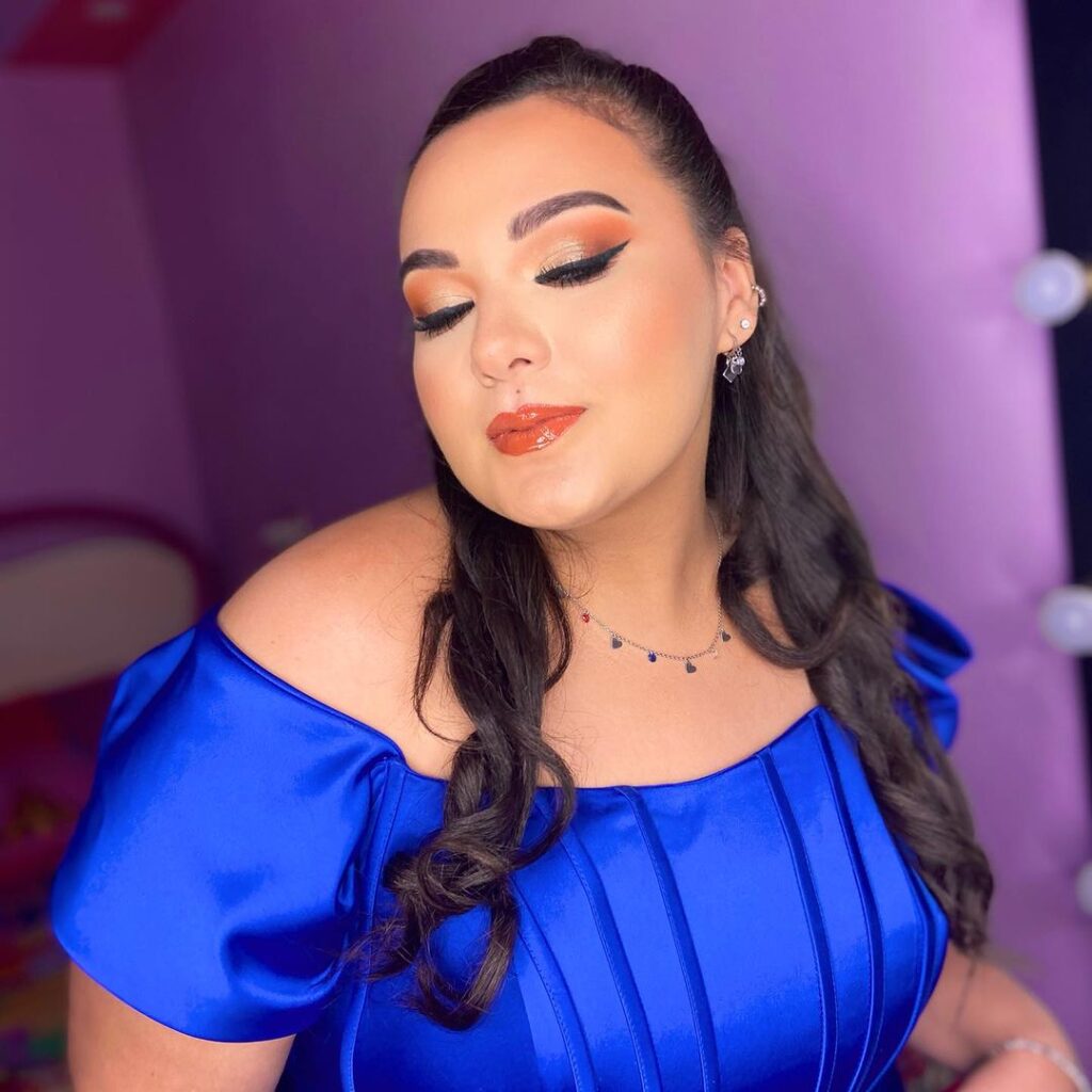 sunset glam prom makeup and a blue dress