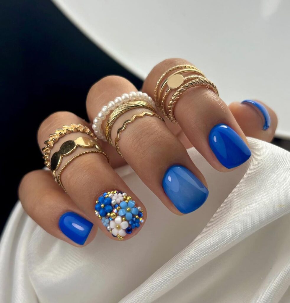 blue jewelry on russian manicure