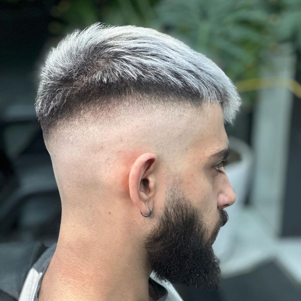 colored textured top with high skin fade
