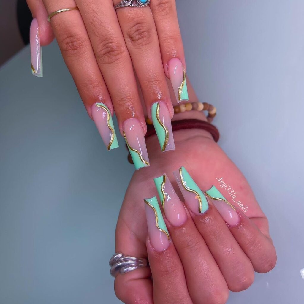 mint green nails with gold outlining