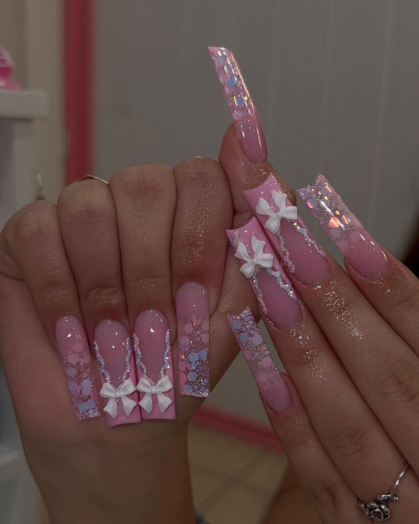 pink glittery acrylic nails with bows