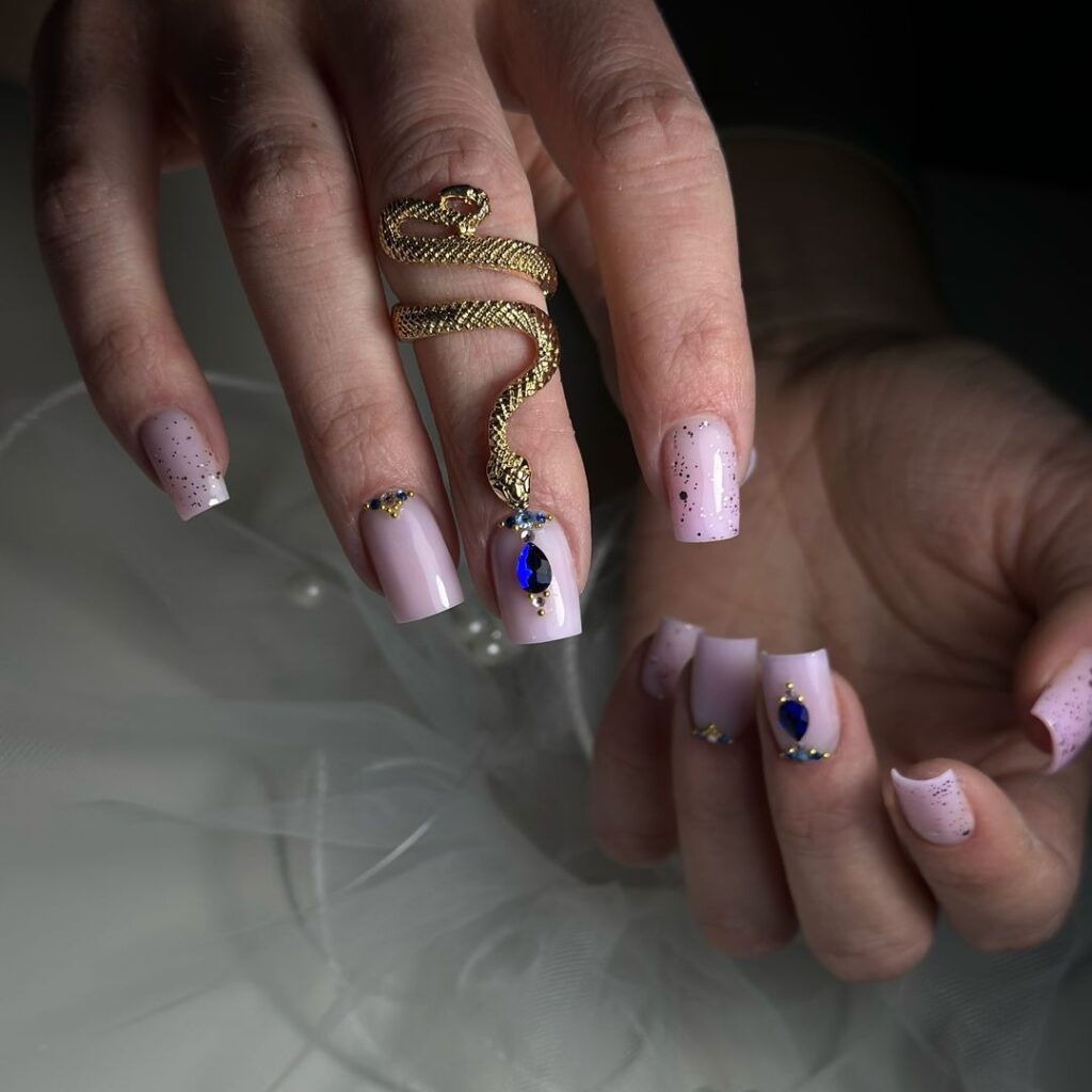 pink nails with blue gem