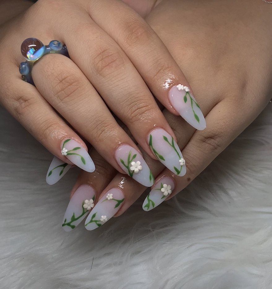 soft white almond nails with green art