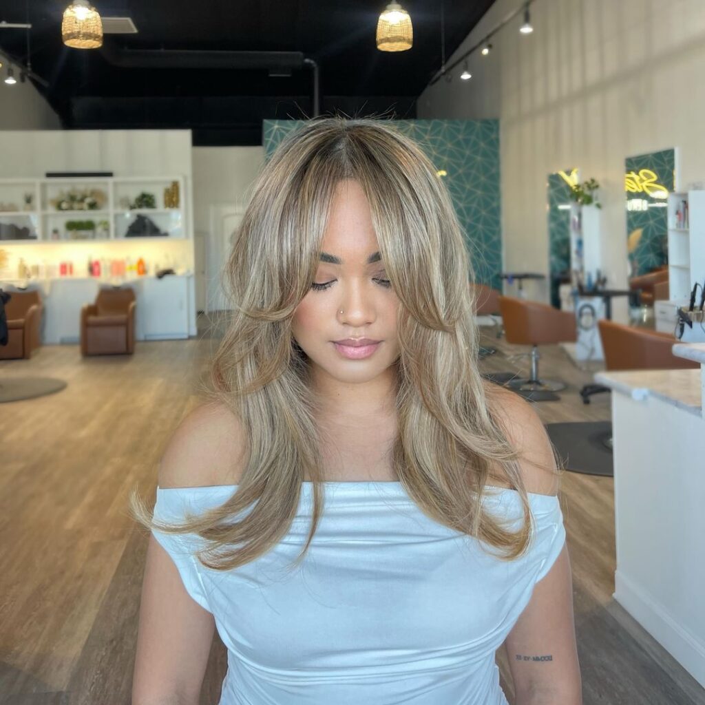 blonde blowdry with curtain bangs