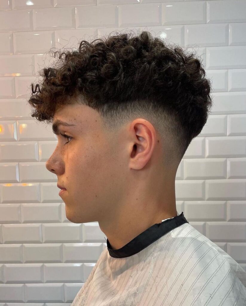 Top 20 Skin Fade curly top with mid skin fade