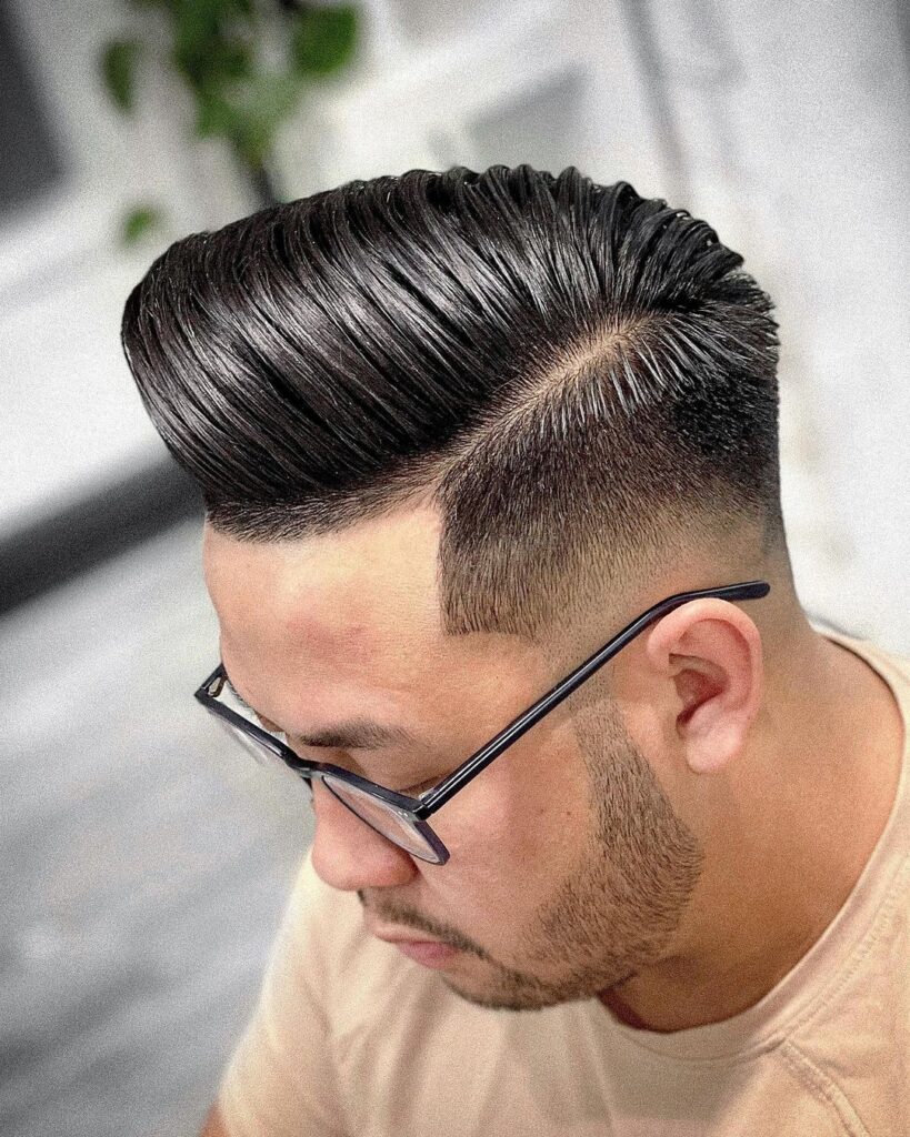 pompadour with hard part and skin fade