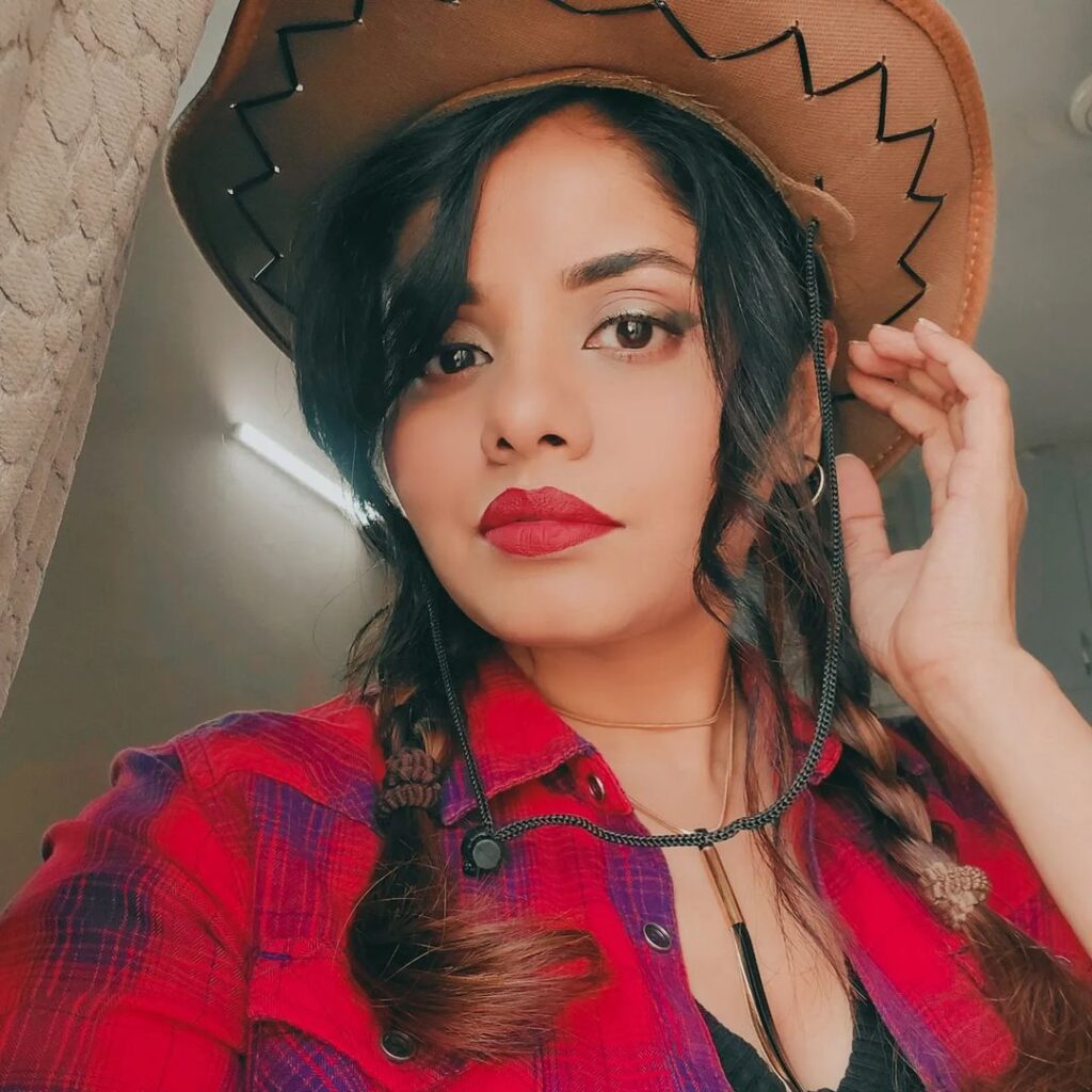 red lips and natural look cowgirl makeup