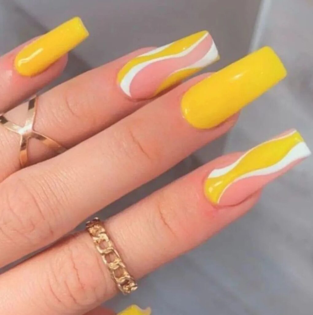 yellow nails with white swirls