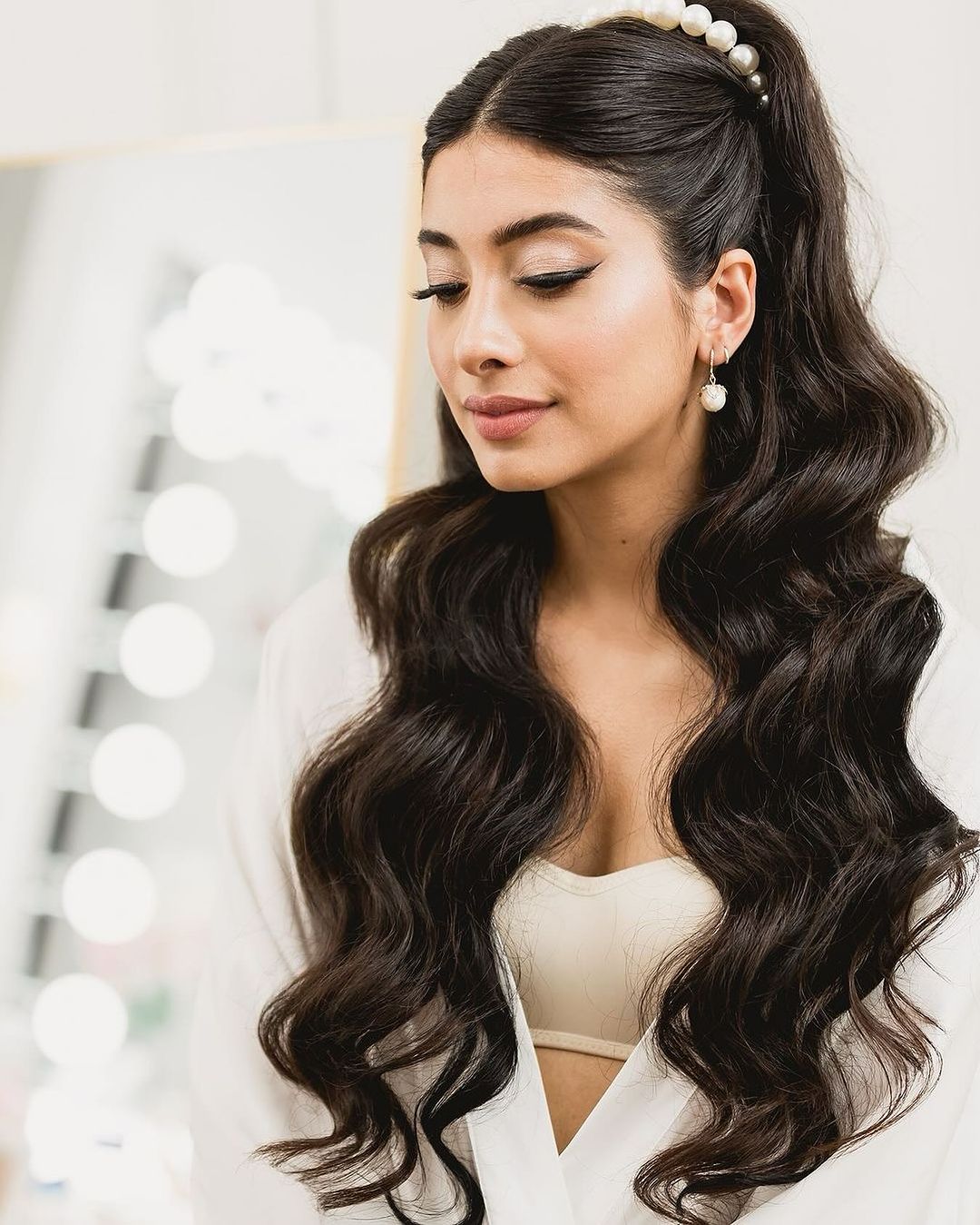 half-up ponytail with hollywood waves