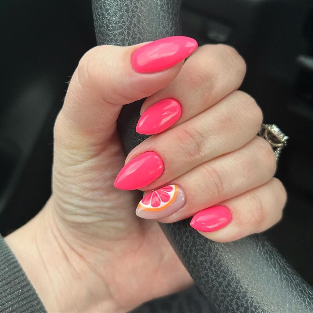 hot pink nails with grapefruit art