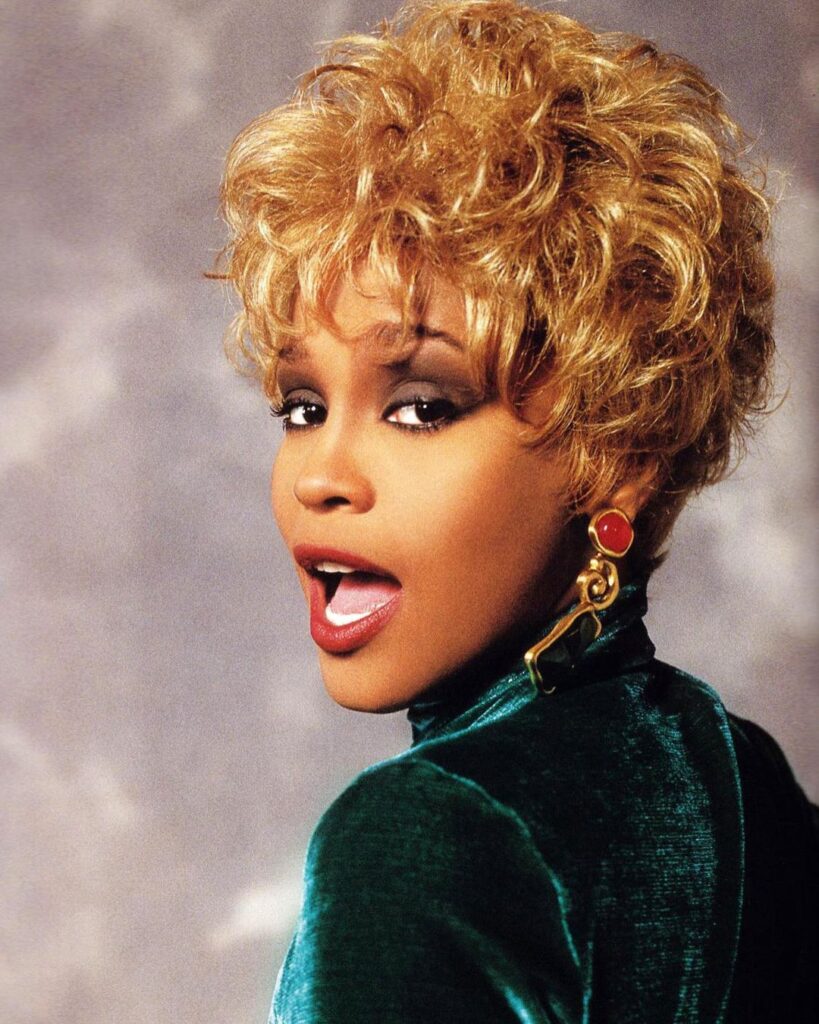 whitney houston with 90s blonde hair