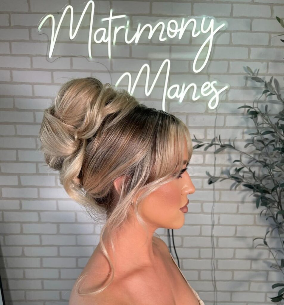 updo for long hair with curtain bangs