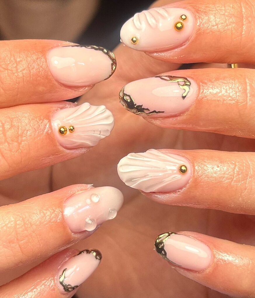 seashell nails with nail jewelry