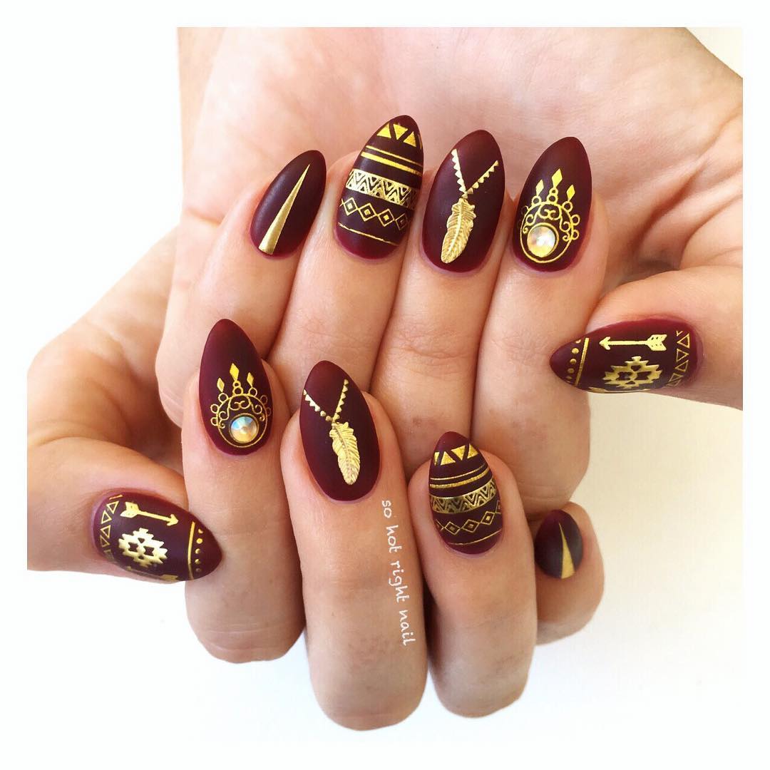 black cherry gold tribal nails