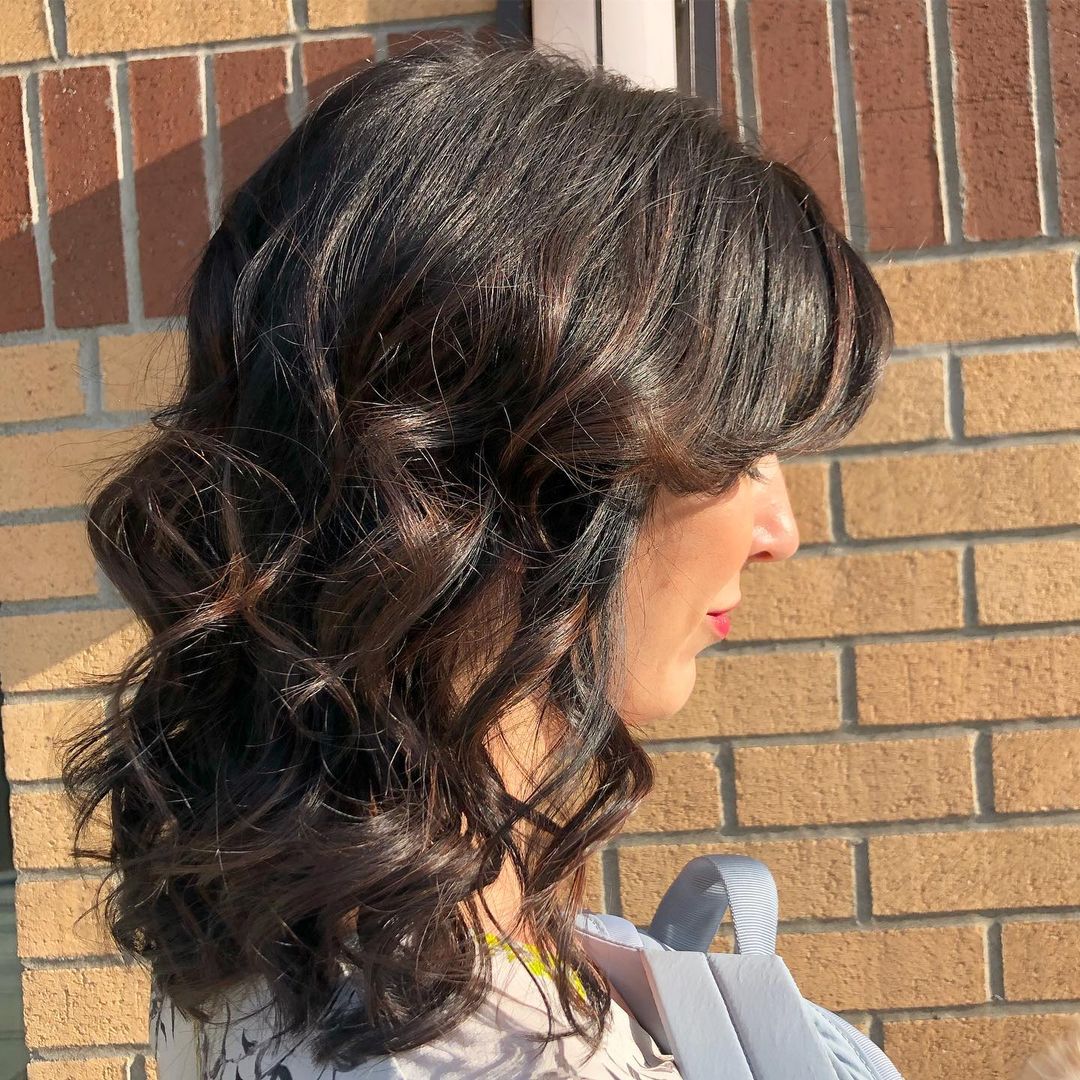 curly with bangs dark caramel balayage