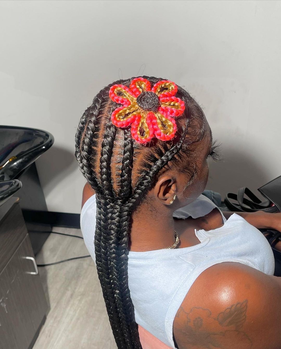 flower braided low ponytail hairstyle