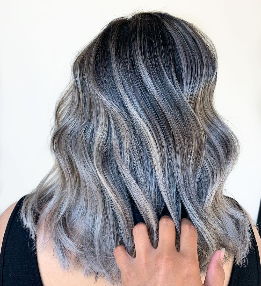 medium wavy brown hair with silver highlights