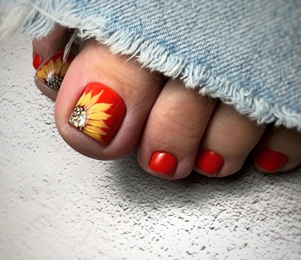 Uñas de los pies rojo girasol