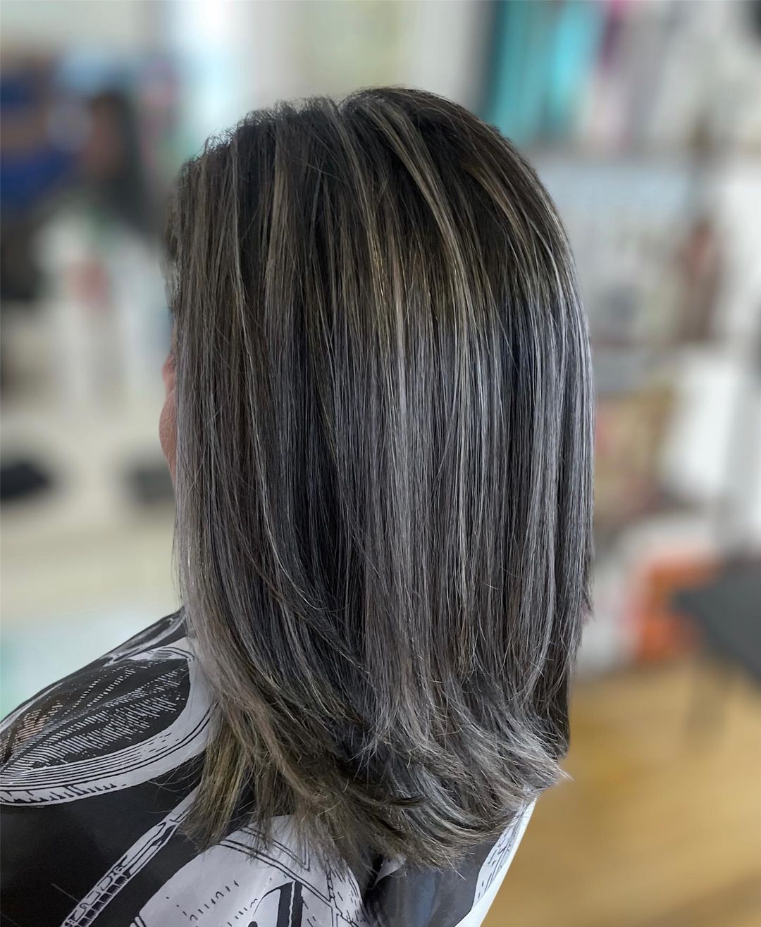 thick brown hair with silver highlights