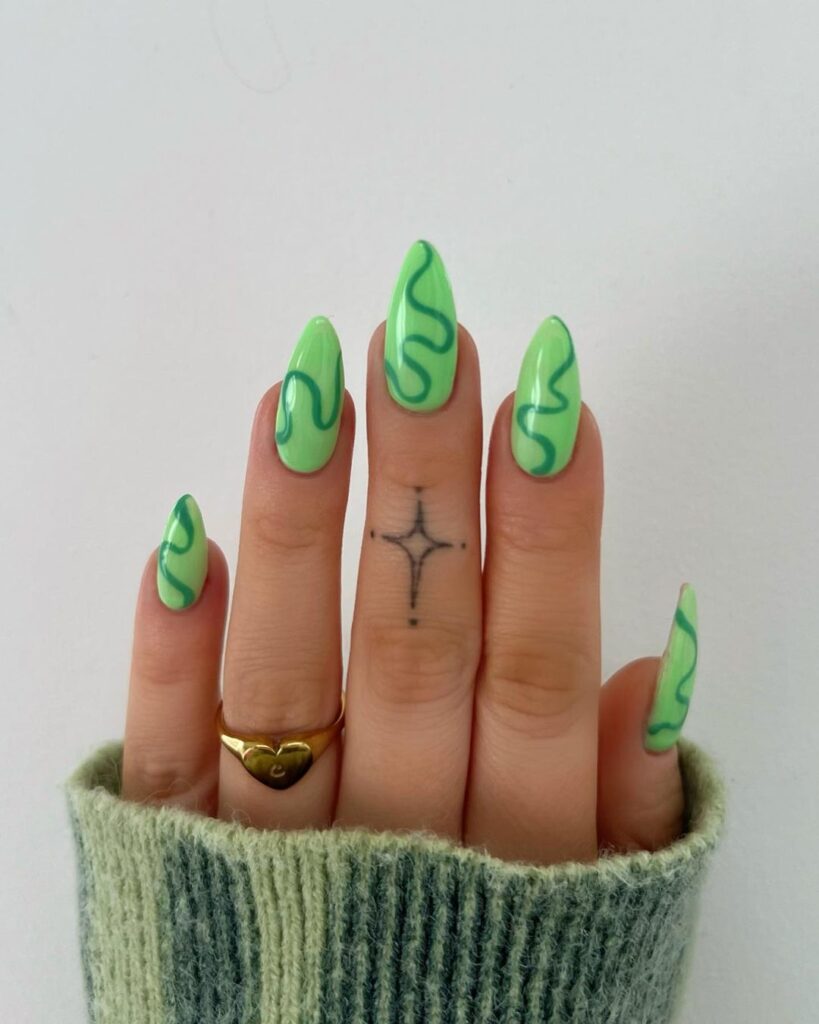 swirls on green nails