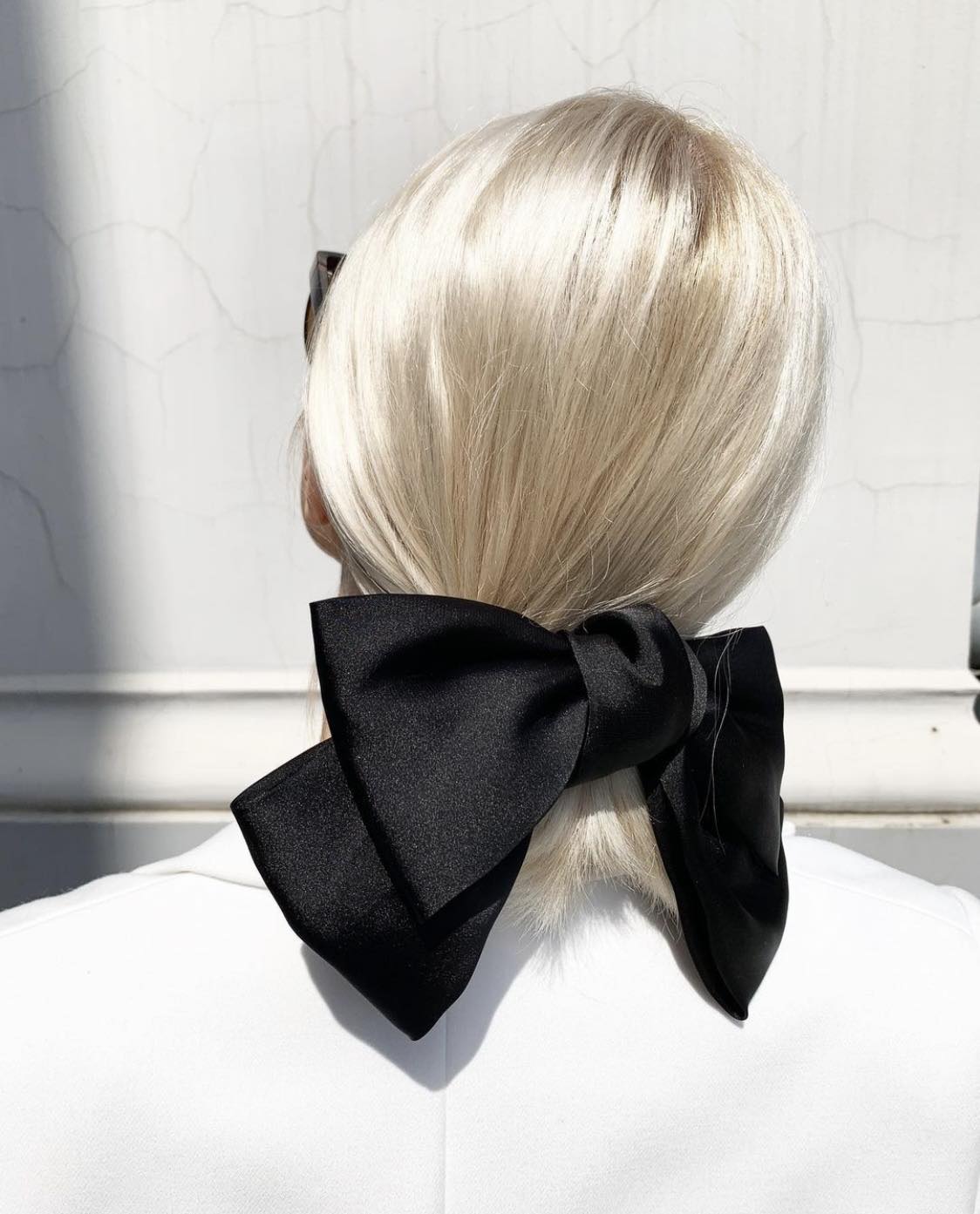 Low Ponytail Hoco Hairstyle With Bow