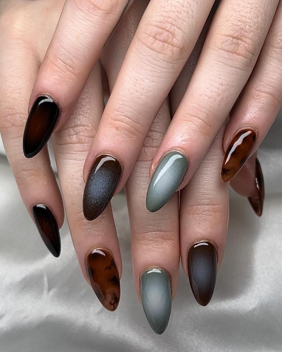 aura nails in all earth tones