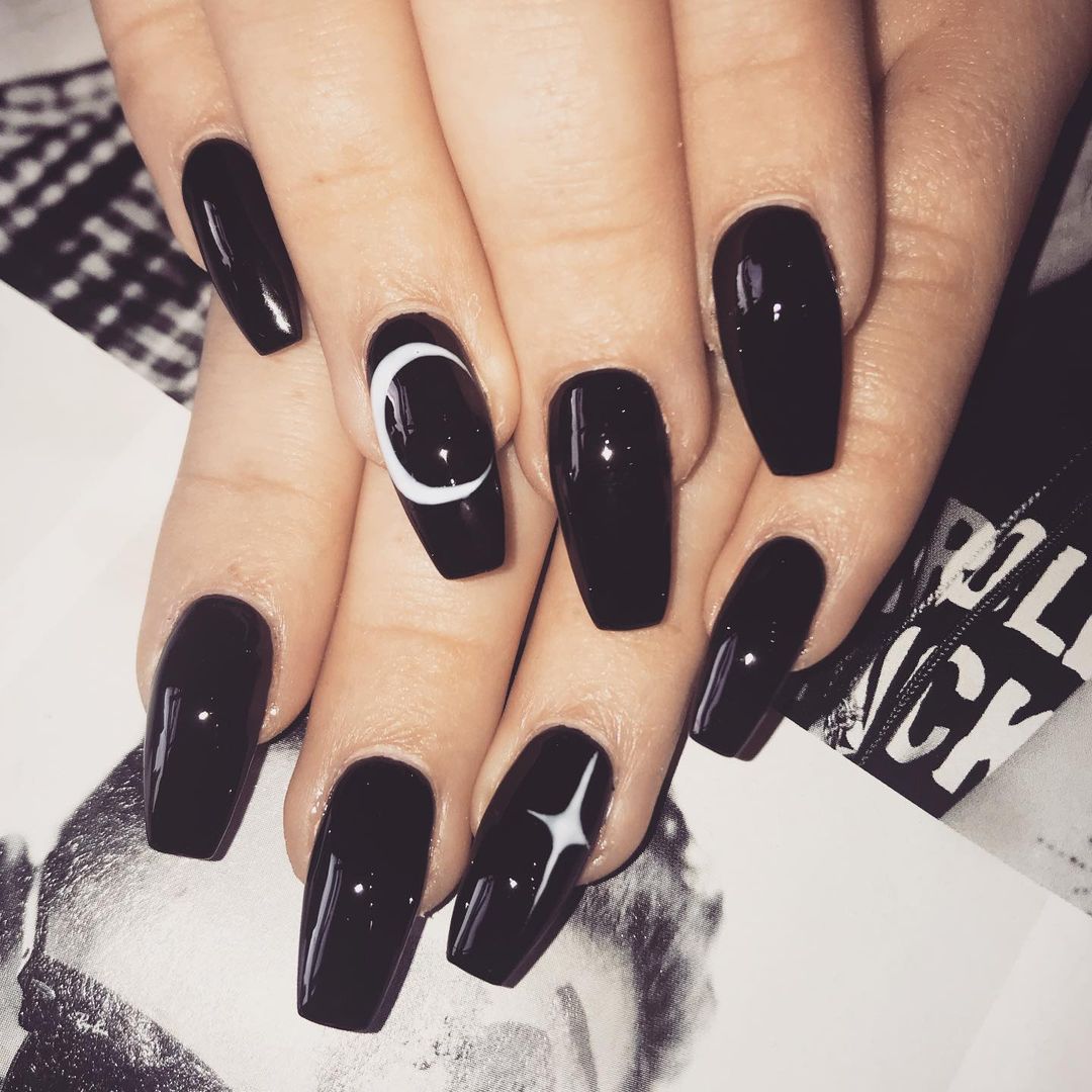 black nails with mystical accents