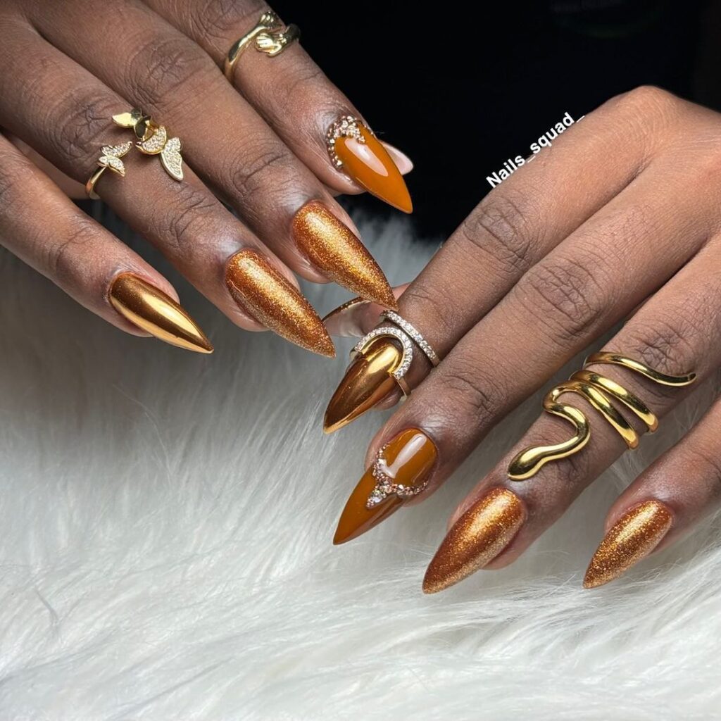 brown and gold stiletto nails