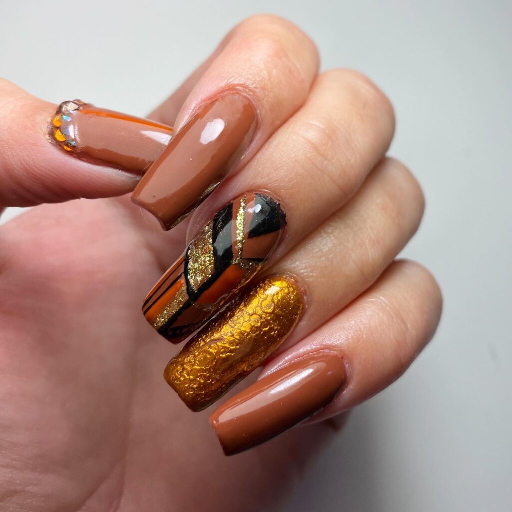 brown nails with golden bubble effect