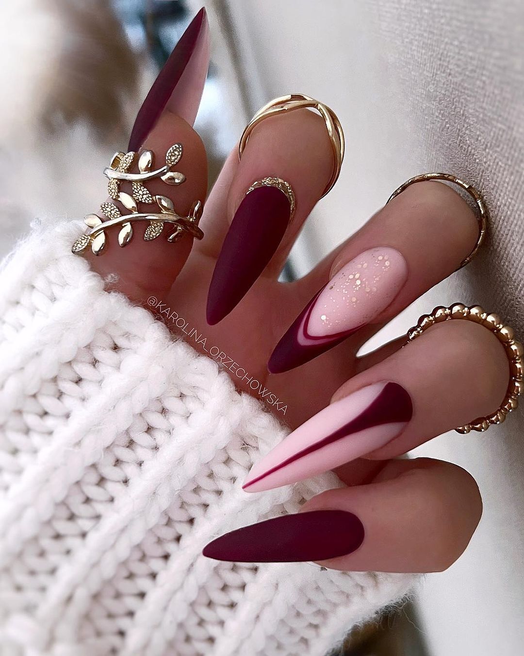 frame it in gold matte burgundy nails