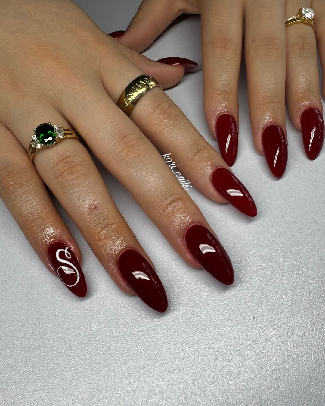 initial burgundy nails