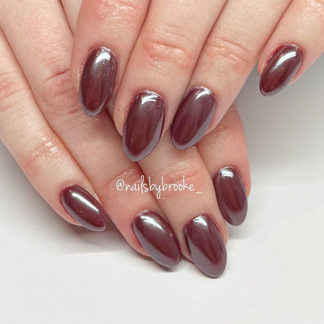 maroon chrome almond-shaped nails