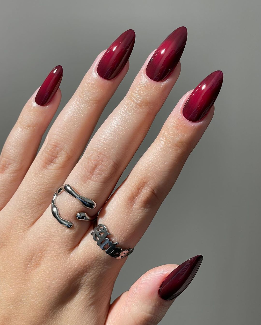 maroon chrome aura nails