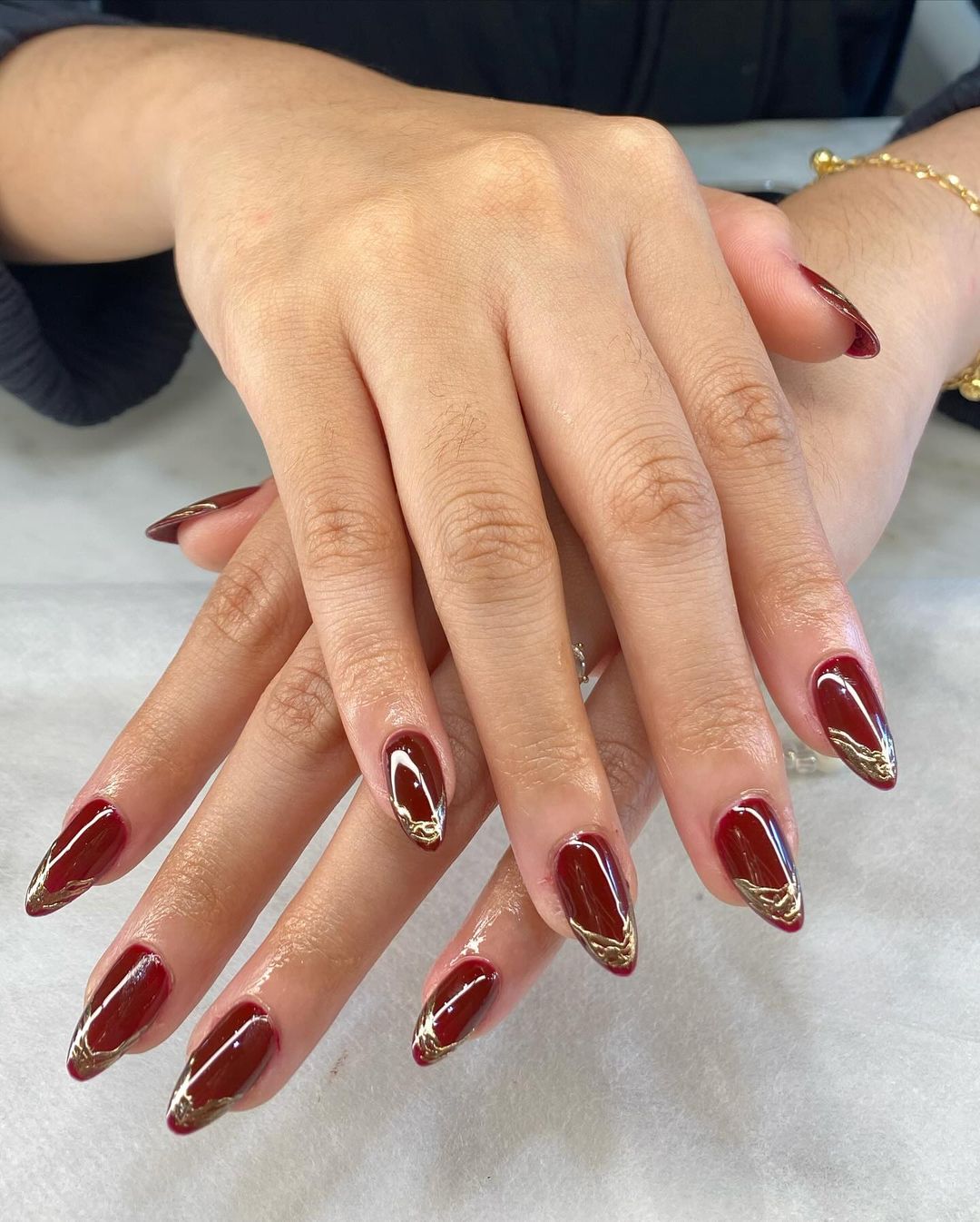 maroon chrome with golden swirl tips