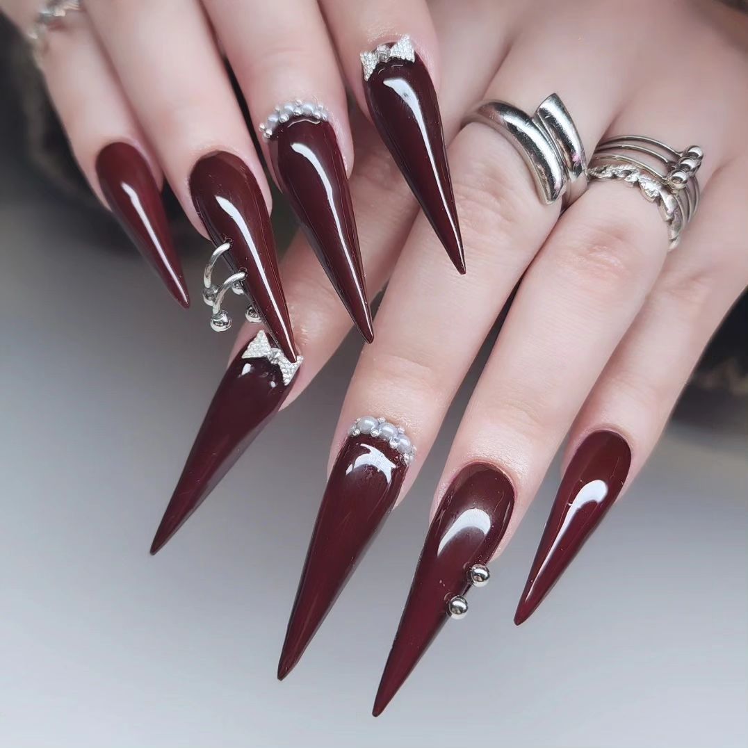 maroon stiletto nails with chrome