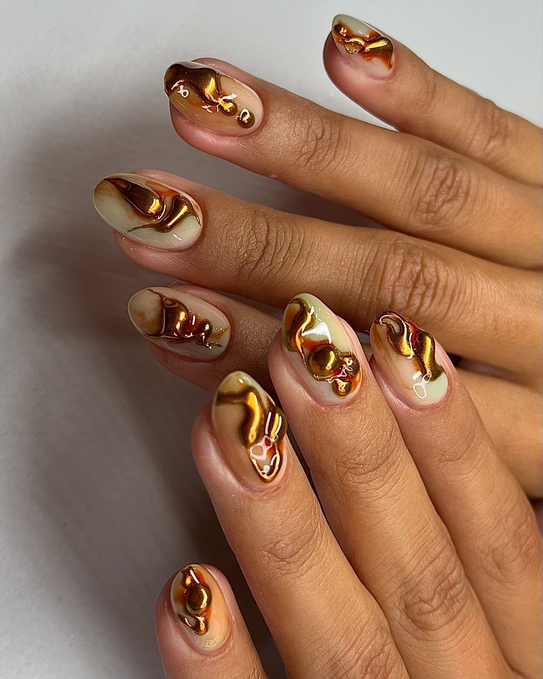 melting toffee brown nail design