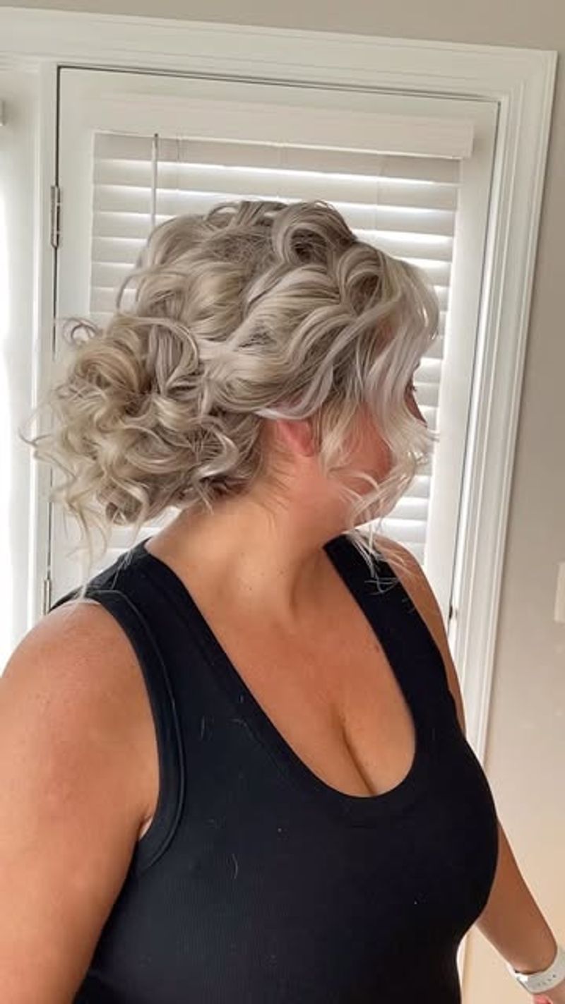 Elegant Updo with Wavy Bangs