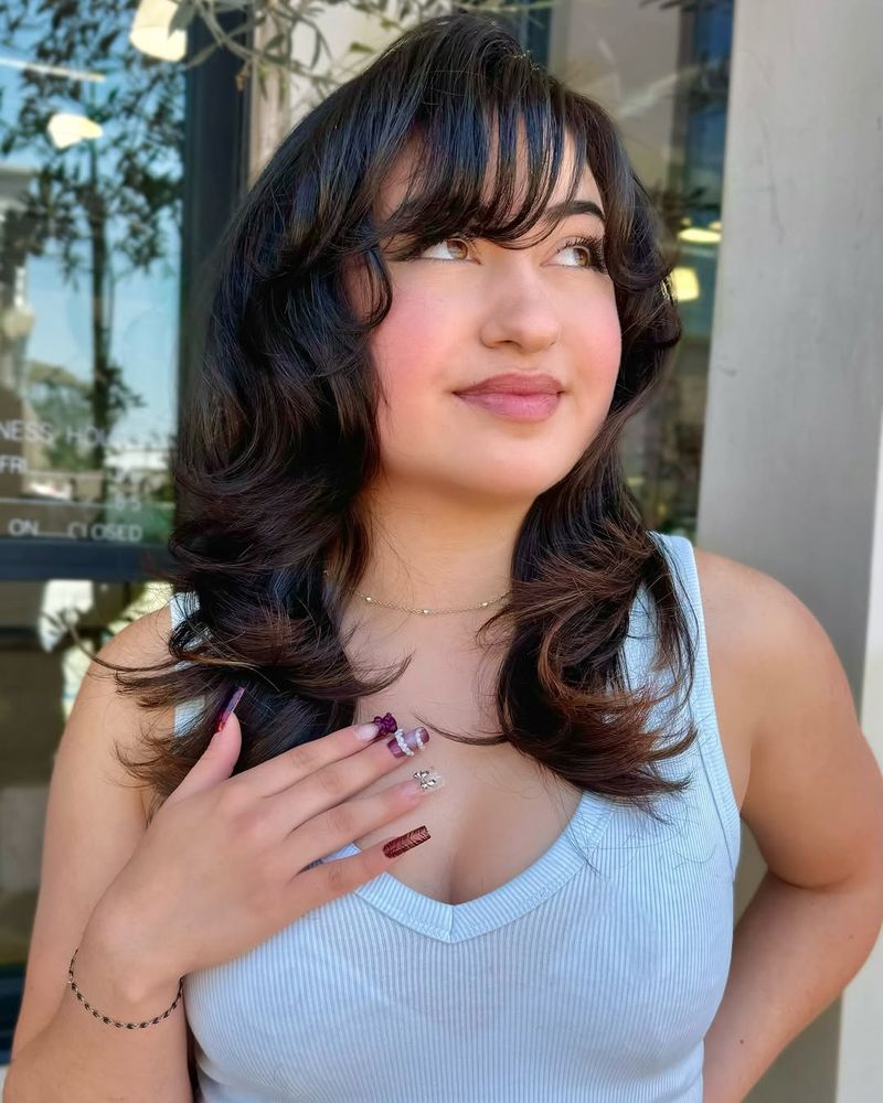 Side-Swept Bangs and Soft Curls