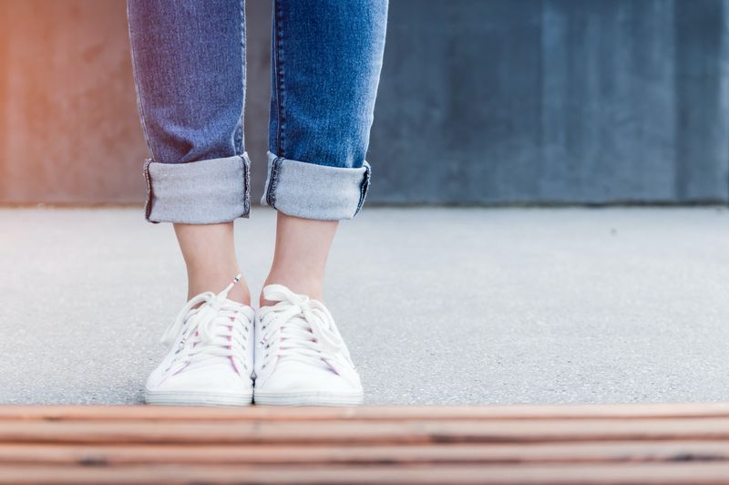 White Sneakers with Rolled-up Jeans