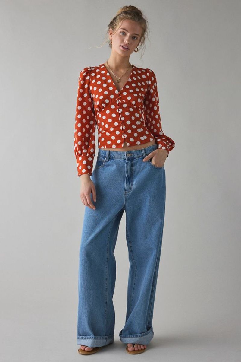 Red and White Polka Dot Blouse with Blue Jeans