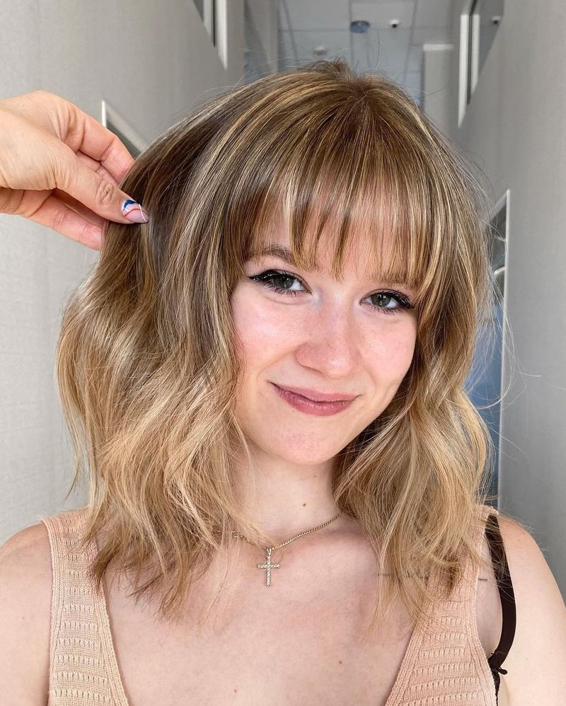 Brow-Skimming Bangs: Eye-Enhancing Frame