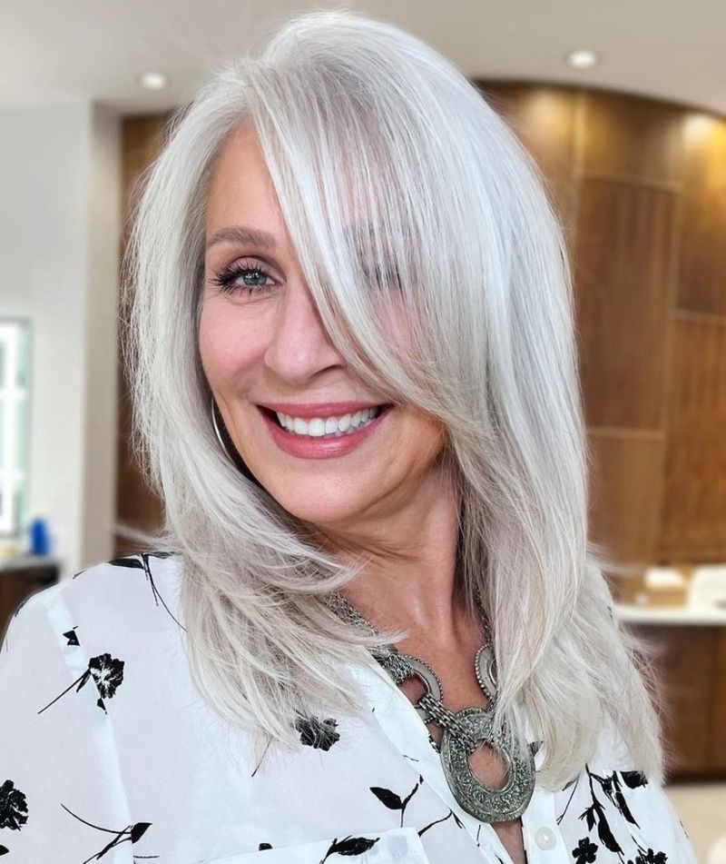 Layered Mid-Length Cut With Side-Swept Bangs