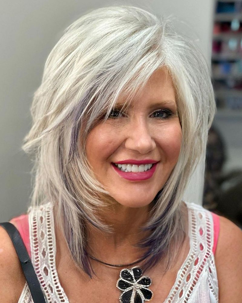 Layered Mid-Length Cut with Side Part
