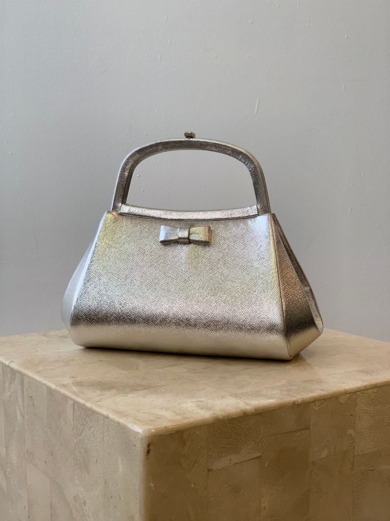 Purses Must Be Carried, Never Worn Crossbody